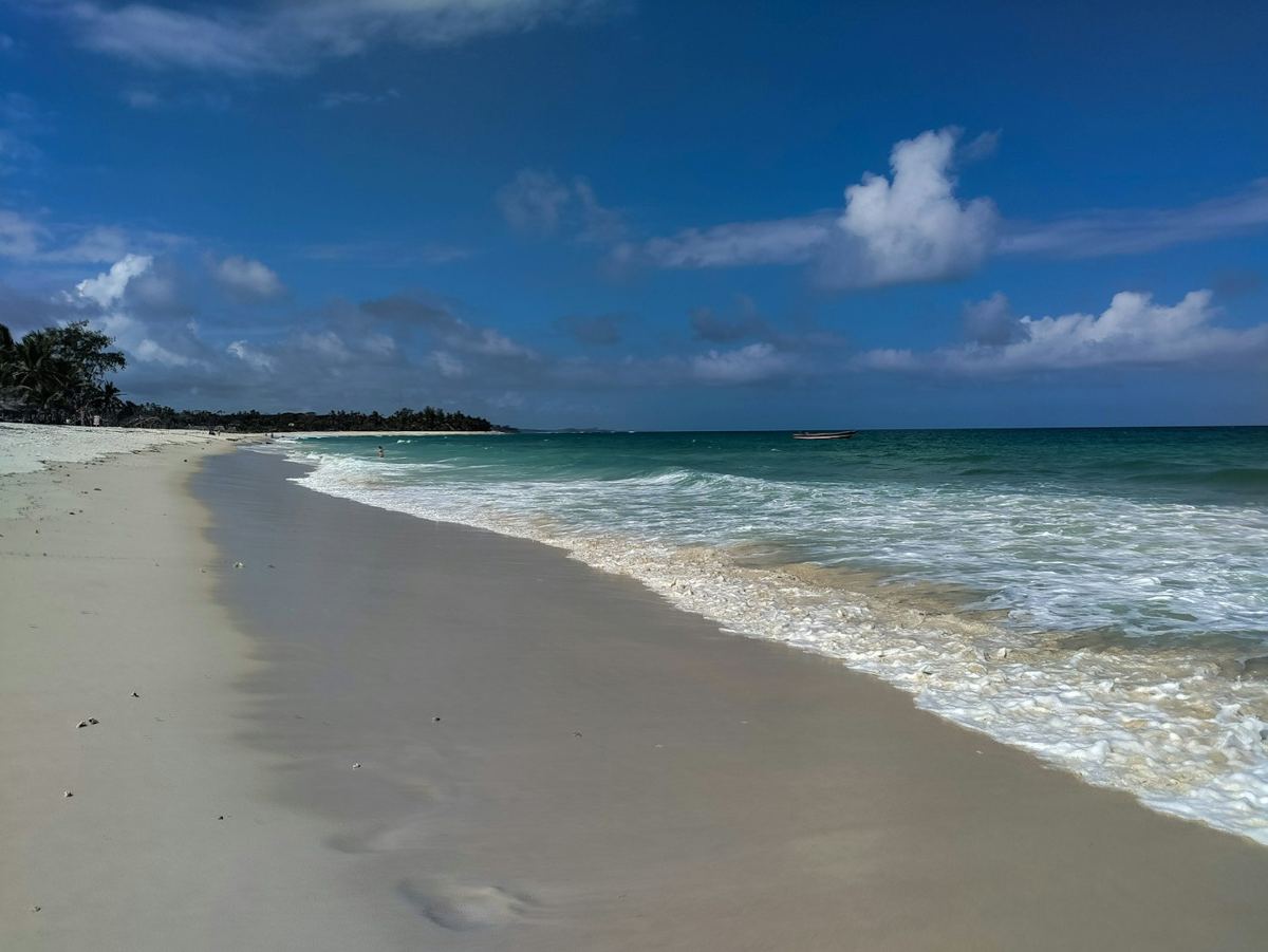 White-sand beach and turquoise water under a blue sky